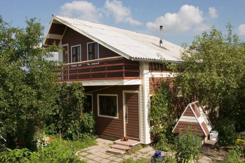 Фасады домов из сайдинга: особенности, фото